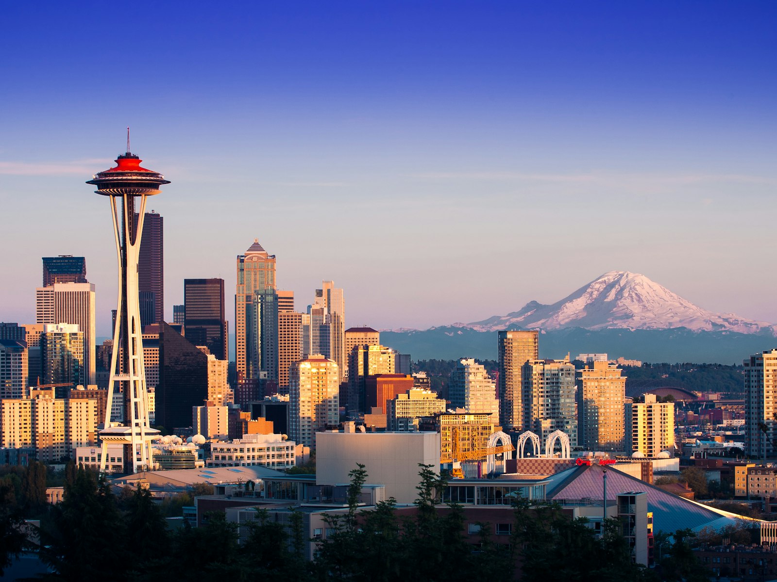 Aerial view of the Seattle skyline with the Space Needle and Mount Rainier in the distance